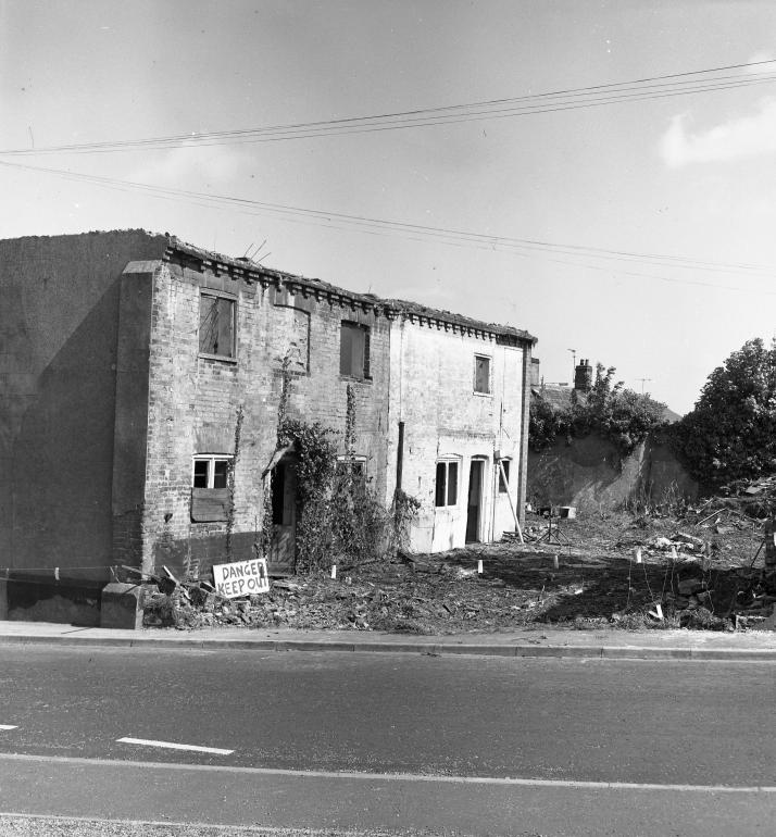 Photograph. Demolition of buildings on corner of Mundesley Road and Vicarage Street (North Walsham Archive).